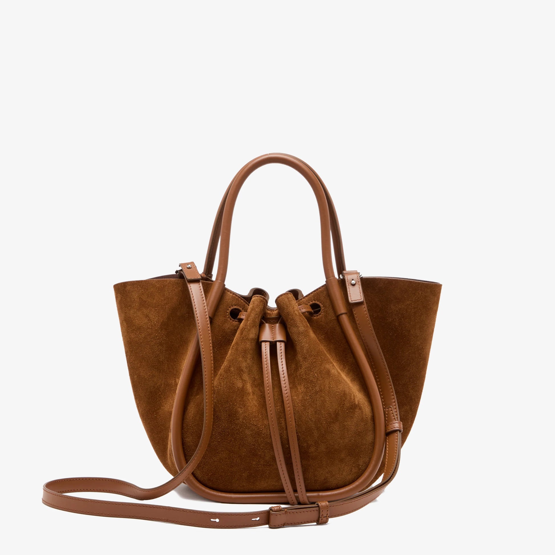 Small Ruched Soft Suede Tote by Proenza Schouler, crafted in brown suede with leather handles and a long adjustable strap, featuring a sculptural silhouette and soft suede texture, displayed against a plain white background.