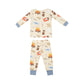 The Angel Dear Smores L/S Loungewear Set, a children's sleepwear set by Angel Dear, comes in beige and features cozy camping-themed illustrations of campfires, s'mores, and tents.