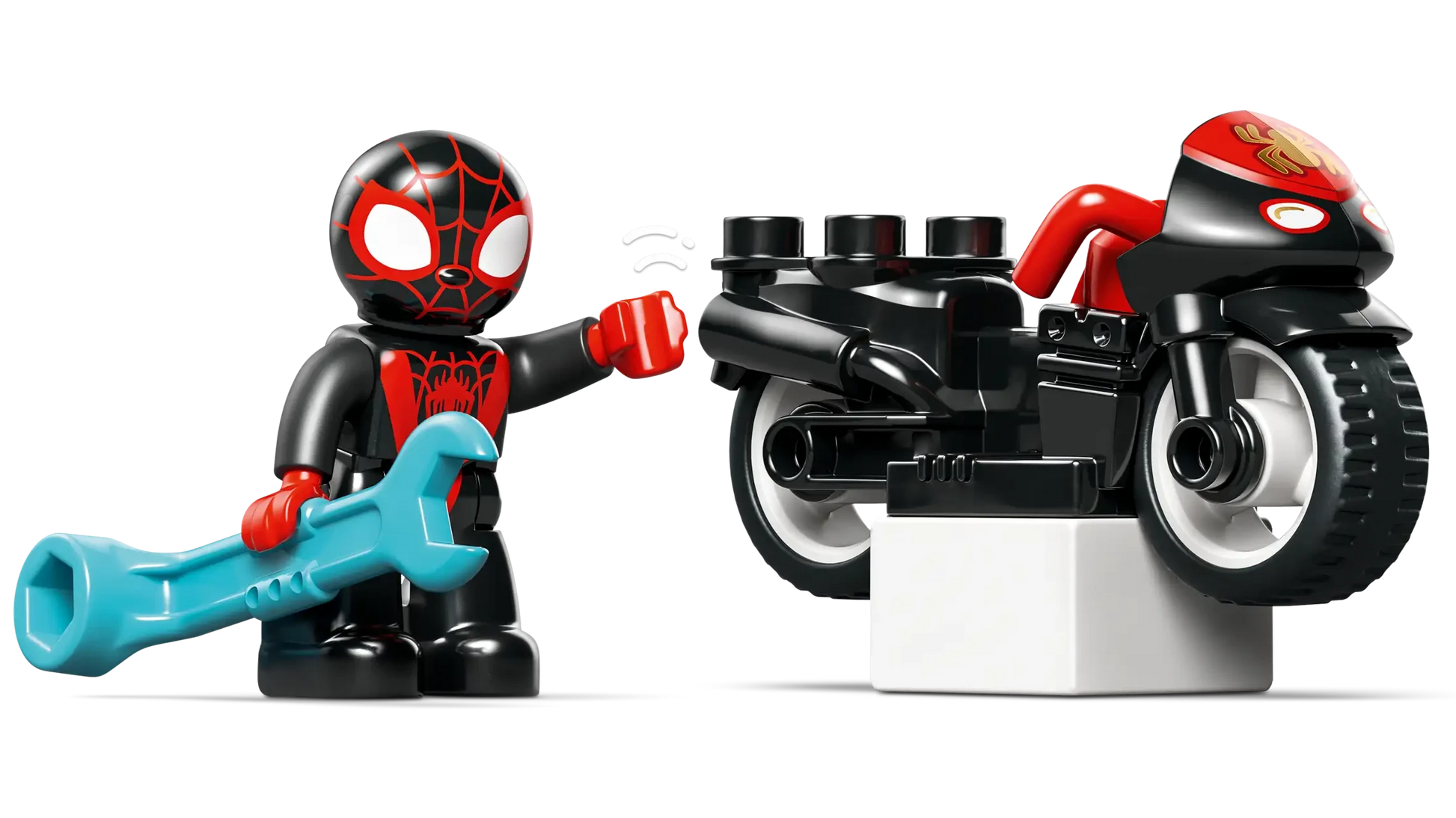 A LEGO® DUPLO® figure in a black and red suit with a blue wrench stands beside a matching motorcycle, inspired by LEGO® DUPLO® Spin's Motorcycle Adventure—an exciting preschool learning toy for imaginative play.