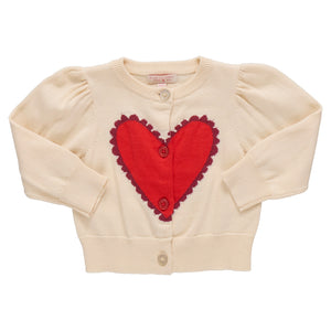 The Pink Chicken Girls' Constance Sweater is a cream cardigan with long sleeves, front buttons, and a large red heart on the chest—perfect for Valentine’s Day.
