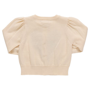 The Girls' Constance Sweater by Pink Chicken is a cream-colored, short sweater with puffed sleeves and ribbed cuffs—a charming choice for Valentine’s Day.