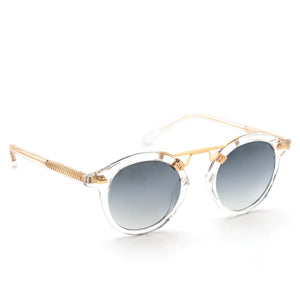 The Krewe St. Louis Mirrored Sunglasses feature a rounded silhouette, transparent frames, gold metal arms, and gradient dark lenses, shown on a white background.