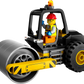 A minifigure from the LEGO® City Construction Steamroller set by Legos - Toyhouse operates a steamroller vehicle equipped with a large front cylinder and rear wheels. The minifigure is dressed in an orange vest, red helmet, and glasses, all while sporting a cheerful smile. Create your own bustling building scenario with this authentic Steamroller Toy from the LEGO Group.