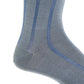 Close-up of the Dapper Classics Steel Gray with Indigo Blue Vertical Stripe Cotton Sock, linked toe, mid-calf, shown on a foot against a white background.
