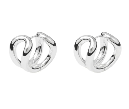 The Steffie Earrings by Lie Studio feature small, bold hoops with an intertwined abstract loop design in polished gold-plated sterling silver, shown on a white background.