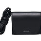 The Lie Studio Stella Wallet is a compact black crossbody bag made from Italian cow leather with a flap closure, detachable strap, and "LIÉ STUDIO" logo embossed on the front—a sophisticated and versatile accessory.