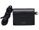 The Lie Studio Stella Wallet is a compact black crossbody bag made from Italian cow leather with a flap closure, detachable strap, and "LIÉ STUDIO" logo embossed on the front—a sophisticated and versatile accessory.