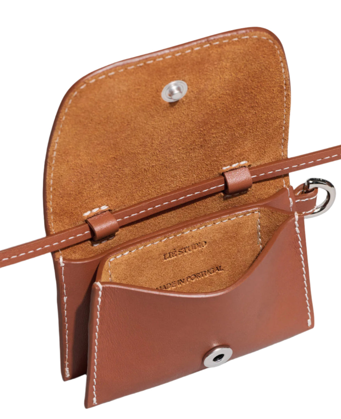 The Stella Wallet by Lie Studio is a small brown crossbody bag made from Italian cow leather with white stitching, shown open to highlight its interior and snap button closure, showcasing a refined, versatile design.