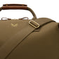 The Bennett Winch Canvas Weekender is a bag made with green waterproof canvas, featuring brown full-grain leather handles and a gold buckle on the strap.