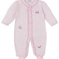 The Kissy Kissy Fairway Foursome Stripe Footie, made by Kissy Kissy, is a pink and white striped baby onesie crafted from soft Pima cotton for ultimate comfort, featuring embroidered designs and charming ruffled edges.