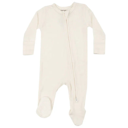 The Angel Dear Solid Sugar Swizzle 2-Way Zip Footie, made by Angel Dear, is a cream-colored baby onesie crafted from bamboo fiber fabric. It features full-length sleeves and footed legs, with a diagonal zipper running from the neck to the ankle for easy changes while naturally regulating your little one's body temperature for optimal comfort.