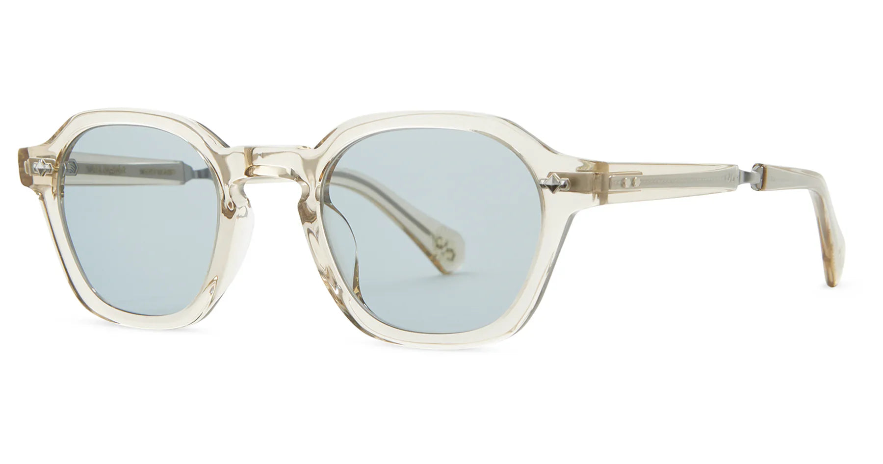 The Mr. Leight Rell Sunglasses from Mr. Leight feature a geometrical silhouette with clear frames and light blue lenses, shown from a side angle.