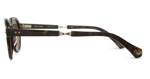 Side view of Mr. Leight Rell Sunglasses showcasing a tortoiseshell design with a geometrical silhouette, rectangular frames, and visible hinges on the temples.