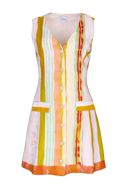 The Suni Dress by Hunter Bell NYC is a sleeveless, mini linen-rayon dress with vertical stripes in yellow, orange, pink, and blue. It features a button-down front, two front pockets, and a flattering V-neckline.
