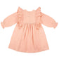 The Early Sunday Suzanne Dress is a delightful pink, long-sleeved outfit for children, featuring ruffled shoulders, floral embroidery, and a buttoned back. Made from soft cotton double gauze, it offers both style and comfort.