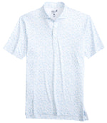 Johnnie-O's Swing Juice Polo is a light blue-speckled shirt made from lightweight, moisture-wicking fabric. It features a folded collar and short sleeves, shown against a white background.