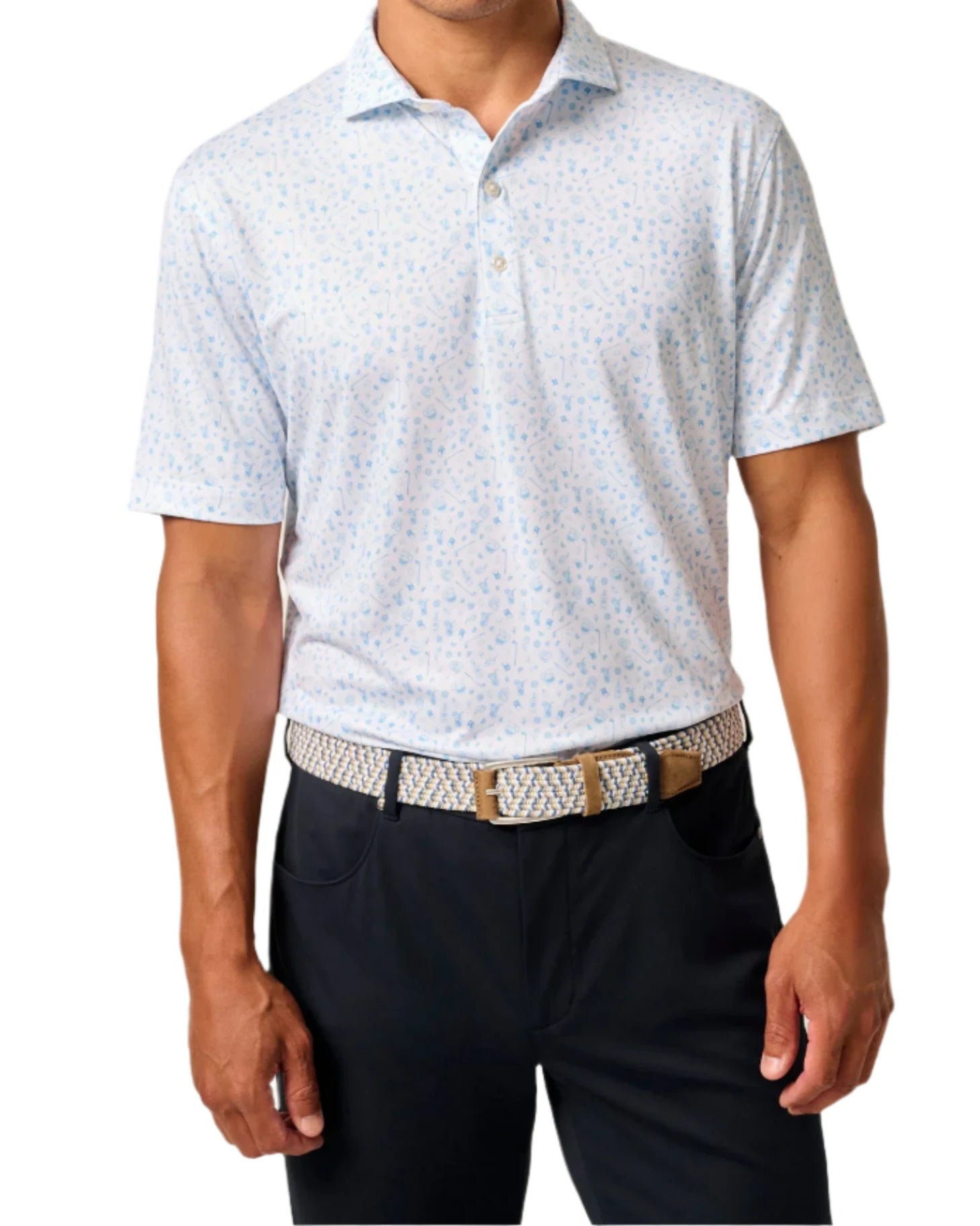 A person in a Johnnie-O Swing Juice Polo in light blue, paired with black pants and a chic patterned belt, stands against a white background.