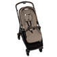 The Nuna SWIV Stroller by Nuna features a brown and black design with a padded seat, harness system, and front guard. It is equipped with four wheels that offer 360-degree swivel for easy maneuverability and includes a handlebar for effortless pushing.