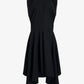The Sybella Dress by Proenza Schouler is a sleeveless black cotton piece with a fitted bodice and flowing asymmetrical handkerchief hem, shown against a plain white background.