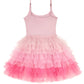 The Girls’ Angelina Tutu Dress by Tutu du Monde features a sleeveless design with adjustable straps and a layered ombre tutu skirt in shades of light pink to bright pink.
