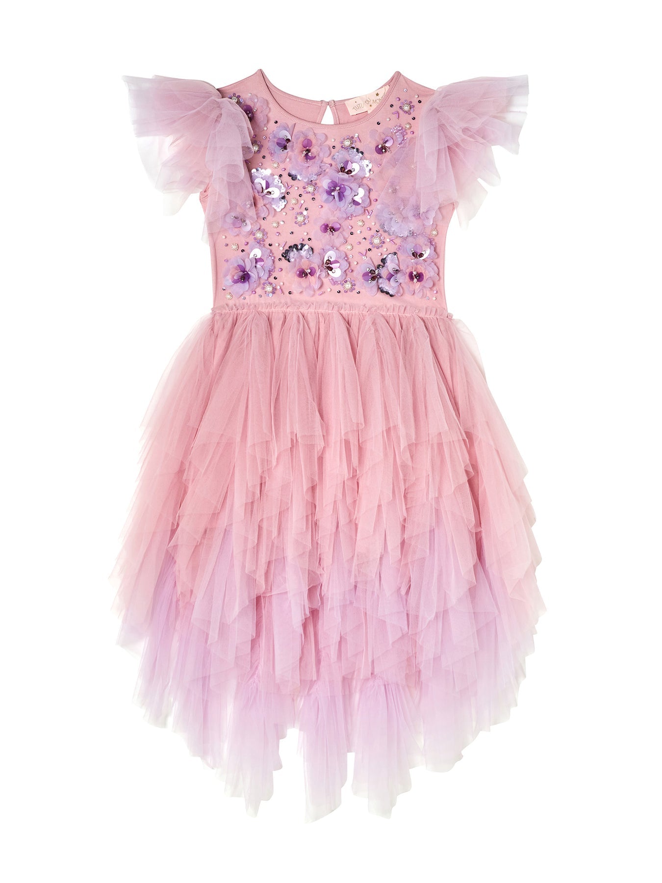 The Girls’ Sparkle in Bloom Tutu Dress by Tutu du Monde captivates with its pink ruffled tulle design in the whimsical Fairy Floss Mix, featuring short, layered sleeves and intricate 3D floral appliqué on the bodice, elegantly set against a white background.