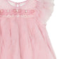 Close-up of the Tutu du Monde Summit Sparkle Tulle Dress, featuring pink tulle, ruffled sleeves, beaded accents, and a sheer overlay for a winter fairytale vibe.