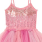 The Girls’ Bebe Shirley Sparkle Tutu by Tutu du Monde features spaghetti straps, a sequin-embellished bodice, and a multi-layered tulle skirt in varying shades of pink, bringing a charming peach blush hue to this delightful dress for little girls.
