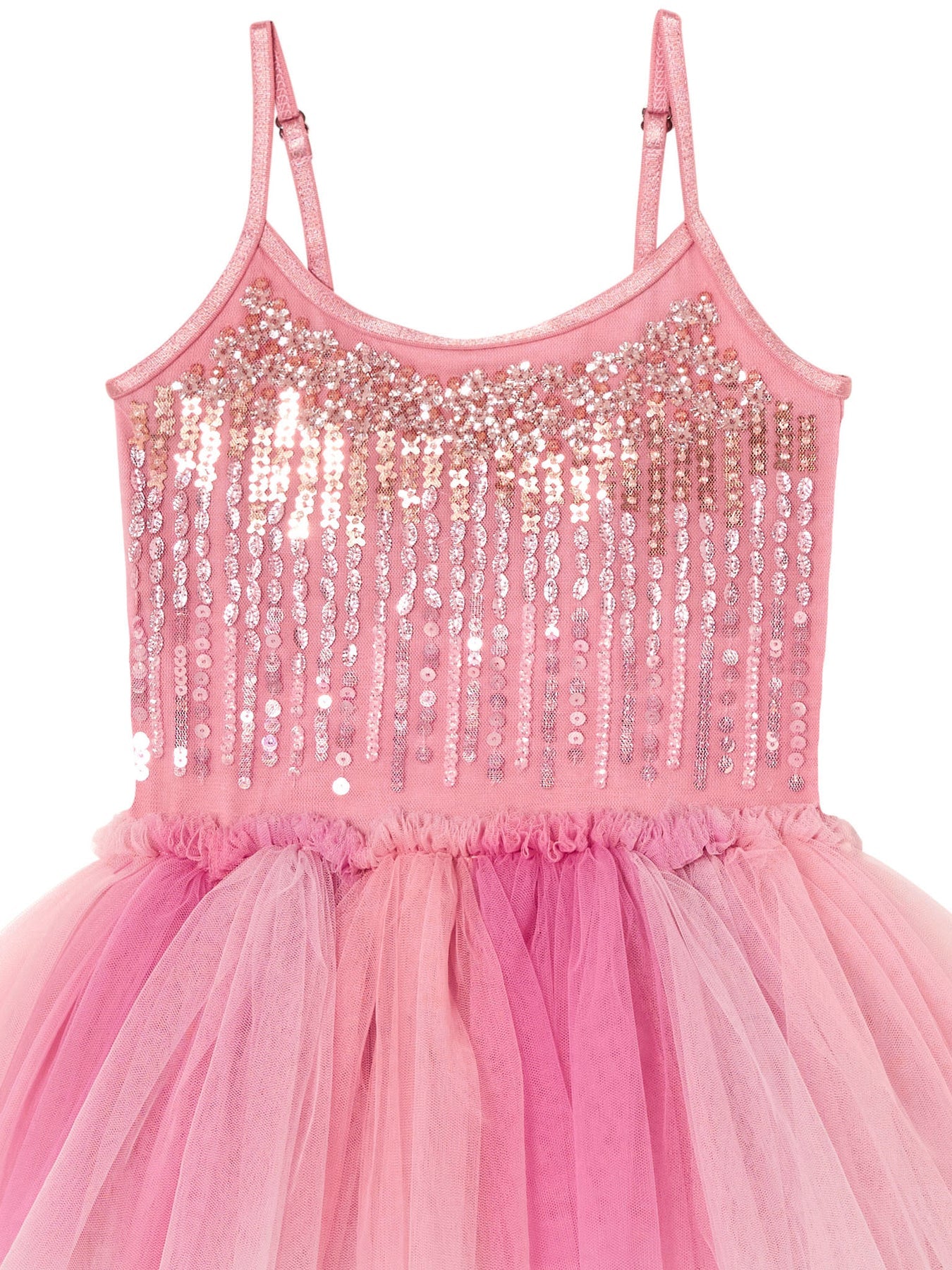 The Girls’ Bebe Shirley Sparkle Tutu by Tutu du Monde features spaghetti straps, a sequin-embellished bodice, and a multi-layered tulle skirt in varying shades of pink, bringing a charming peach blush hue to this delightful dress for little girls.