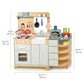 The Tenderleaf La Fiamma Grand Kitchen by Tender Leaf Toys includes a stove, sink, oven, shelves, play utensils, and food items with dimensions of 39.37" W x 39.76" H x 24.41" D and a top shelf height of 12.8". The set also features a charming pizza oven and accessories for endless imaginative play.