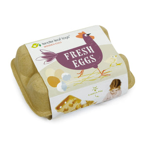 A closed Wooden Eggs toy carton labeled “Fresh Eggs,” featuring a charming chicken illustration and designed by Tender Leaf Toys for creative pretend play, contains realistic wooden eggs.