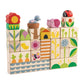 A stack of Garden Blocks by Tender Leaf Toys features colorful wooden pieces adorned with nature-themed illustrations—such as flowers, animals, plants, and patterns—arranged in a rectangular formation. These push and click blocks are designed to enhance hand-eye coordination while introducing children to delightful garden shapes.