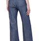 A person wearing the Tonne Pant from Callas Milano, featuring a stretch denim design with short sleeves and wide-leg pants, is standing facing away from the camera.