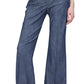 Wearing Callas Milano's Tonne Pant, a person showcases a stylish high-rise trouser look with hands casually in pockets against a plain white background.