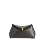 The Toteme T-Lock Clutch is a black Palmellato leather bag featuring a gold T-Lock clasp and a structured, minimalist design.