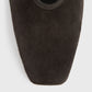 Close-up of Toteme's Minimalist Suede Ballerinas in dark brown, featuring a square toe and crafted in Spain, displayed against a plain light background.
