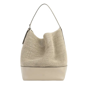 The Toteme Belted Woven Leather Tote features a beige crochet upper, smooth leather base, spacious interior, and a single shoulder strap for easy carrying.