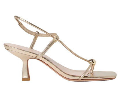 The Loeffler Randall Triana Mid Heel Sandal showcases gold strappy detailing with a square toe, low block heel, front toe loop, and adjustable ankle strap against a white background—making it the perfect mid-heel sandal for elegant occasions.