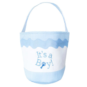 The Bits & Bows "It's a Boy Tote" is a white and light blue fabric tote with a handle, featuring "It's a Boy!" and a rattle graphic on the front—an ideal sustainable gift for welcoming a baby boy.