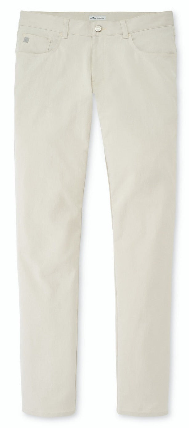 A pair of Peter Millar beige pants with buttons and pockets, featuring a Peter Millar eb66 Performance Five-Pocket Pant design.