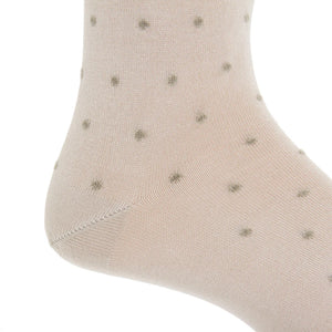 Close-up of a light beige Dapper Classics Dot Cotton Mid Calf Sock featuring small, evenly spaced gray polka dots, highlighting the heel and ankle area—an elegant option for men’s dress socks.