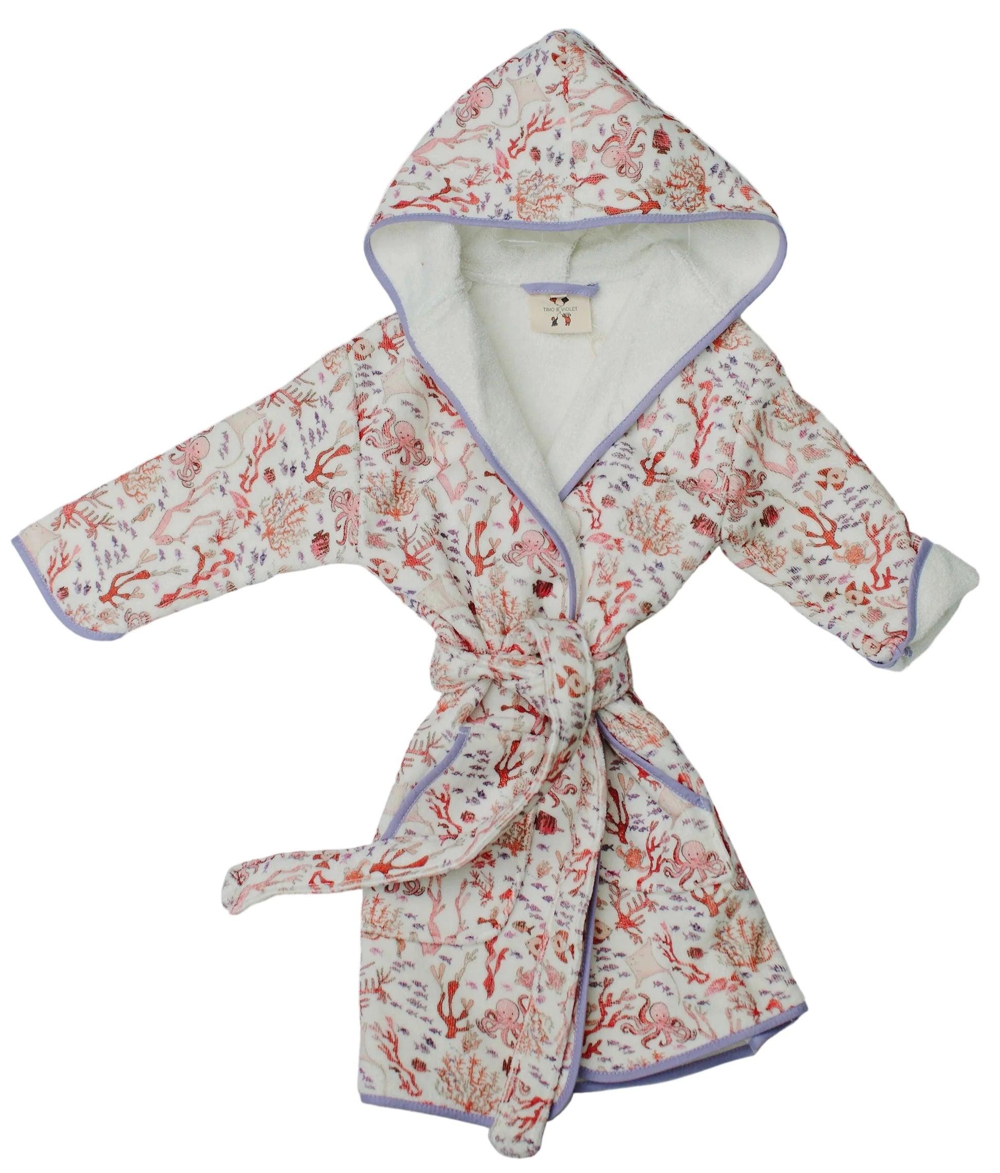 The Timo & Violet Kids' Bathrobe features a Coral Reef motif with pink and coral floral branches, purple trim, and a matching belt. Made from ultra-soft velour cotton terry for cozy comfort.
