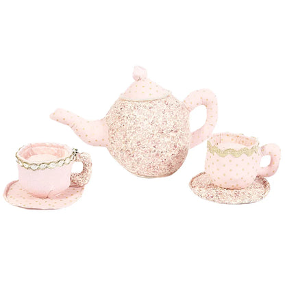 The Mon Ami Floral Stuffed Toy Tea Set includes a pink plush teapot and two teacups with saucers, all adorned with glittery patterns and polka dots.