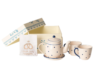 Introduce your little ones to the charming Maileg experience with the "Mail Tea & Biscuits for Two" set. This delightful kids tea set includes polka-dotted ceramic teapots, matching saucers and cups, and a pastry bag, all beautifully arranged in front of a decorative open box. It’s perfect for hosting an enchanting tea party with their favorite Maileg Friend.