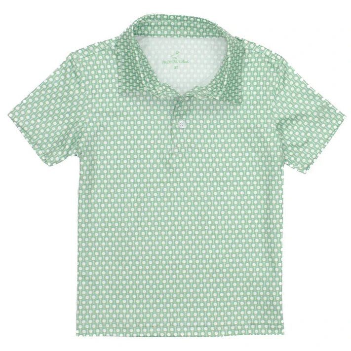 The Boys' Inlet Polo by Properly Tied is a green shirt with short sleeves, a collar, moisture-wicking fabric, and a white circular pattern.