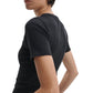 A person is shown from the side and back, wearing Rag & Bone's Essential Ribbed Tee—a fitted, black short-sleeve top made from organic cotton—making it a modern wardrobe staple.