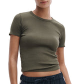 Someone stands against a plain background wearing the Rag & Bone Essential Ribbed Tee in olive green and navy blue drawstring pants—a versatile wardrobe staple.