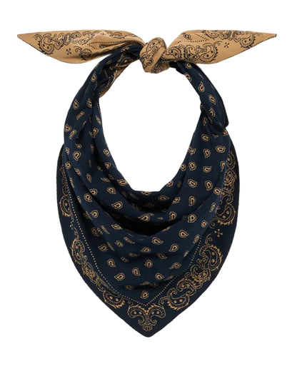 A navy blue and tan reversible paisley jacquard The Wild Rag by Guest in Residence, tied in a knot at the top with the pointed end hanging down.