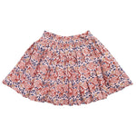 The Pink Chicken Girls' Theodore Skirt by Pink Chicken is adorned with a colorful floral pattern, featuring red, pink, and blue flowers on a light background and an elastic ruffle waist.