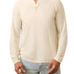 A man wearing a cream Faherty Long-Sleeved Cloud Henley and light blue jeans, standing against a white background.