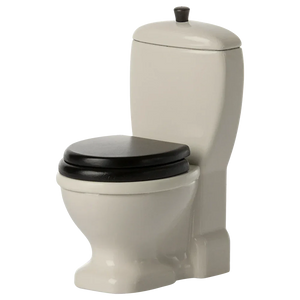 The Maileg Mouse Toilet features an off-white design with a black seat and lid, complete with a tank, top flush button, and playful handle for extra charm.